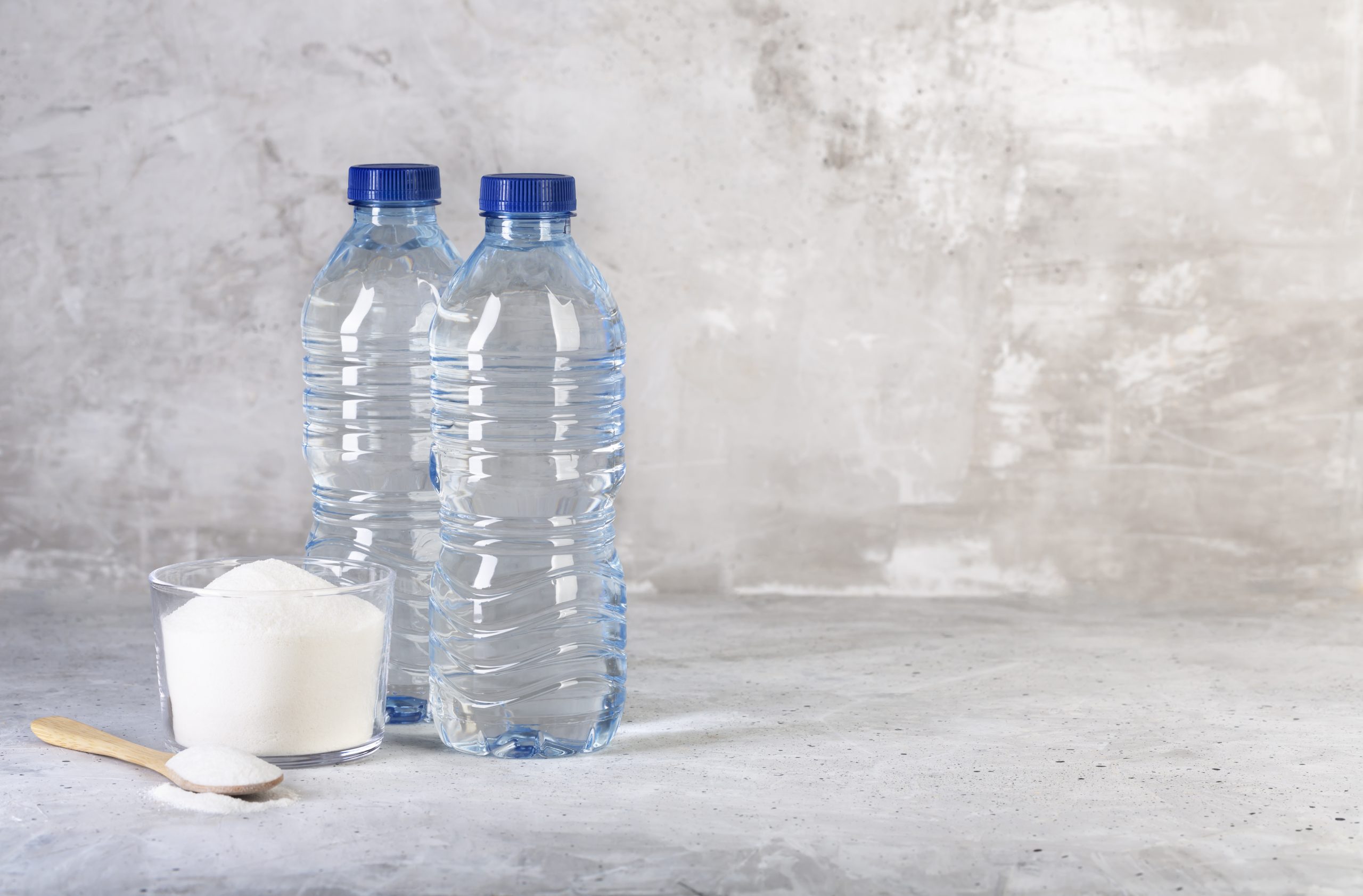 Collagen protein powder and two bottles of water - Hydrolyzed